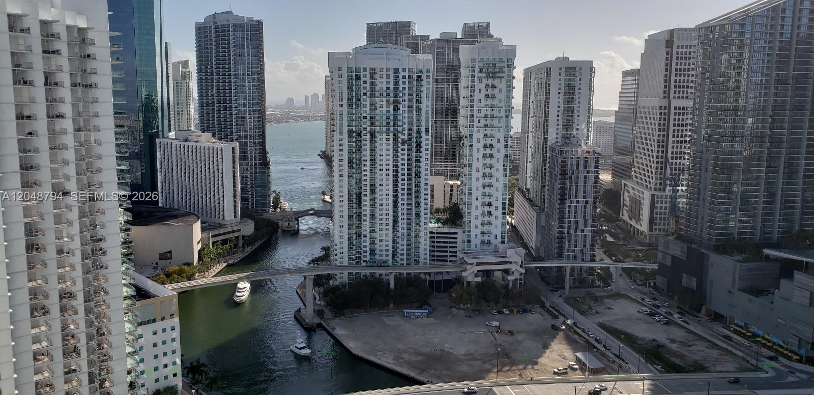 An elevated view of a canal flowing between high-rise apartment buildings in a city — 90 SW 3rd St # 3710, Miami FL 33130, MIAMI, FL