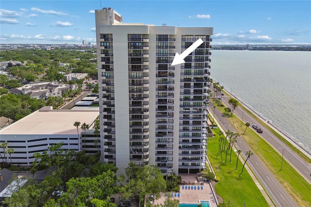 An aerial view of a high-rise condominium building located next to a body of water — 2413 BAYSHORE BOULEVARD UNIT 1904, TAMPA, FL