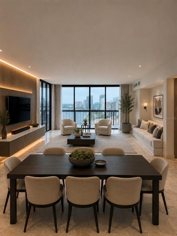 A modern open-concept living and dining room with floor-to-ceiling windows overlooking a city skyline — 2413 BAYSHORE BOULEVARD UNIT 1904, TAMPA, FL