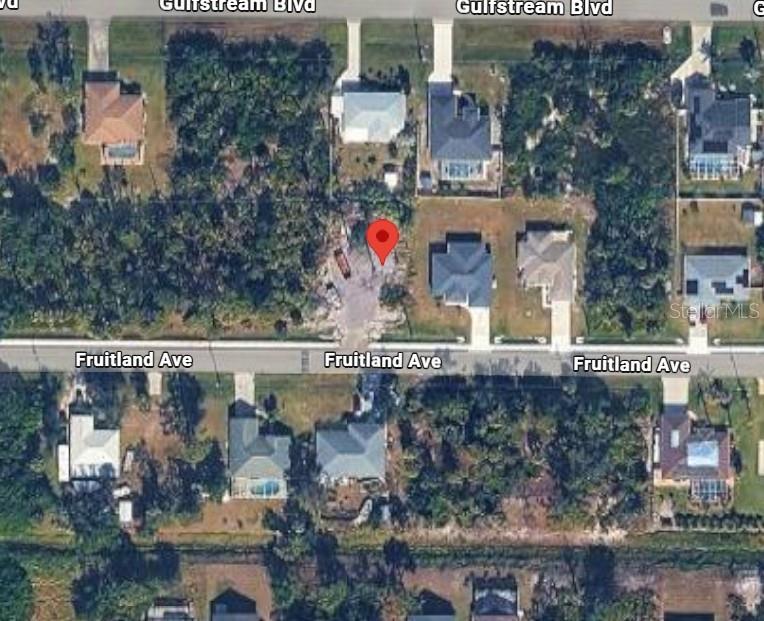 This aerial map shows a vacant residential lot marked with a pin on Fruitland Avenue — 9430 FRUITLAND AVENUE, ENGLEWOOD, FL
