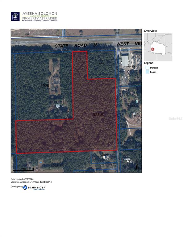 An aerial view shows a multi-lane road running alongside a dense, wooded lot — 000 W NEWBERRY ROAD, NEWBERRY, FL