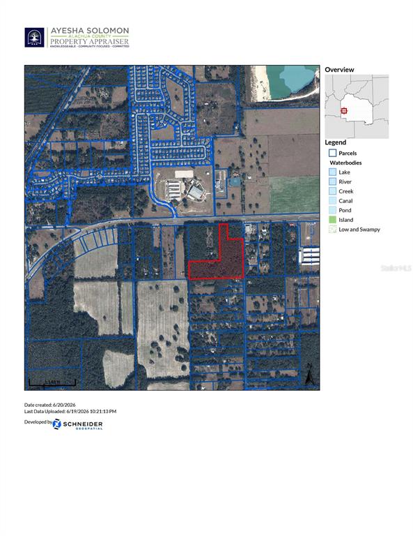 An aerial view shows a dense forest bordering a multi-lane highway — 000 W NEWBERRY ROAD, NEWBERRY, FL