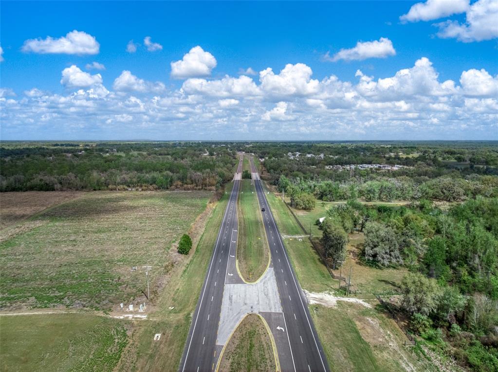 An aerial view of a divided highway running through a rural, grassy landscape — 3515 US HIGHWAY 17 N, BOWLING GREEN, FL