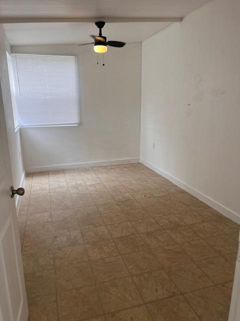An empty room with white walls, tiled flooring, and a ceiling fan with a light — 4149 88th Court S, Boynton Beach FL 33436, BOYNTON BEACH, FL