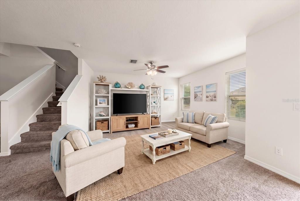The entrance to Walden Woods features a gated driveway lined with tall palm trees — 774 ASHENTREE DRIVE, PLANT CITY, FL