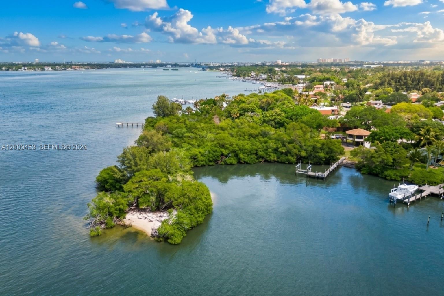 This rendering shows a vacant waterfront lot surrounded by dense trees and a private dock — 18200 49 Terrace N, Jupiter FL 33458, JUPITER, FL