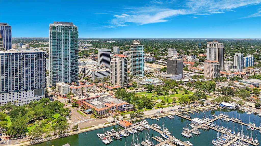 An aerial view of a city skyline featuring high-rise buildings, a park, and a marina — 100 1ST AVENUE N UNIT 1106, ST PETERSBURG, FL