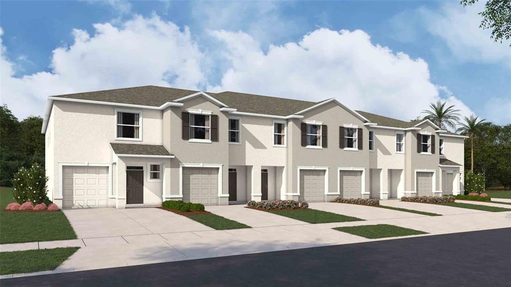 This is a rendering of a multi-unit townhouse building with beige stucco siding and garages — 31243 PAPER BIRCH STREET, WESLEY CHAPEL, FL