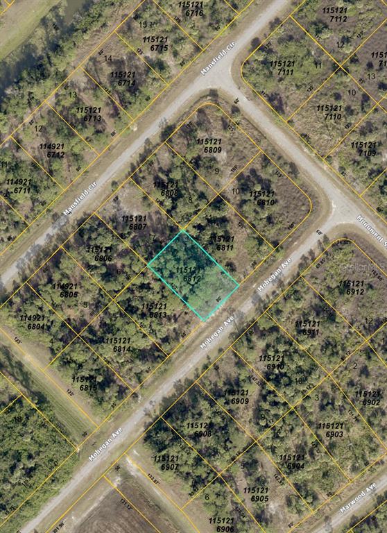 This is an aerial map showing a highlighted vacant lot surrounded by other residential properties — 000 MOHEGAN AVENUE, NORTH PORT, FL