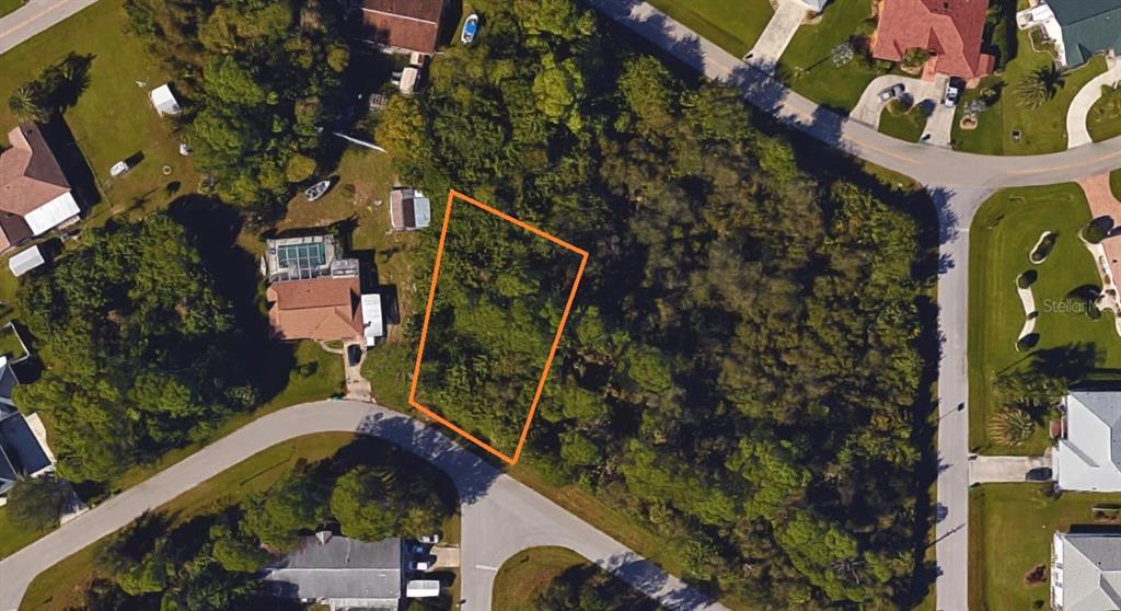 An aerial view shows a vacant, wooded residential lot outlined in orange on a street corner — 468 KELLSTADT STREET NW, PORT CHARLOTTE, FL