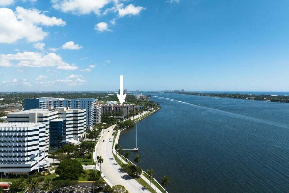 An aerial view shows a waterfront road, office buildings, and a residential complex — 1805 N Flagler Drive # 107, West Palm Beach FL 33407, WEST PALM BEACH, FL