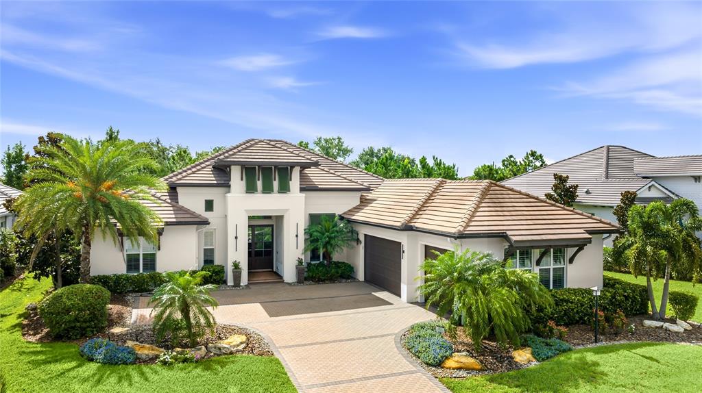 A screened-in patio features a swimming pool with a spa and lounge chairs — 804 CROSSWIND AVENUE, SARASOTA, FL