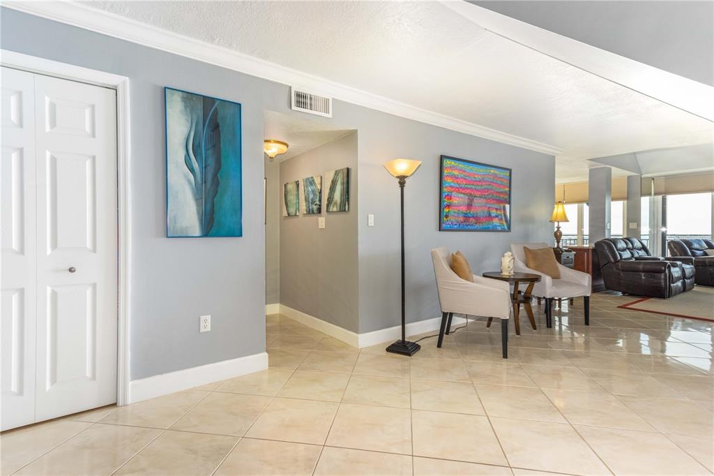 An aerial view of a sandy beach with ocean waves and several high-rise buildings — 1390 GULF BOULEVARD UNIT PH-3, CLEARWATER BEACH, FL