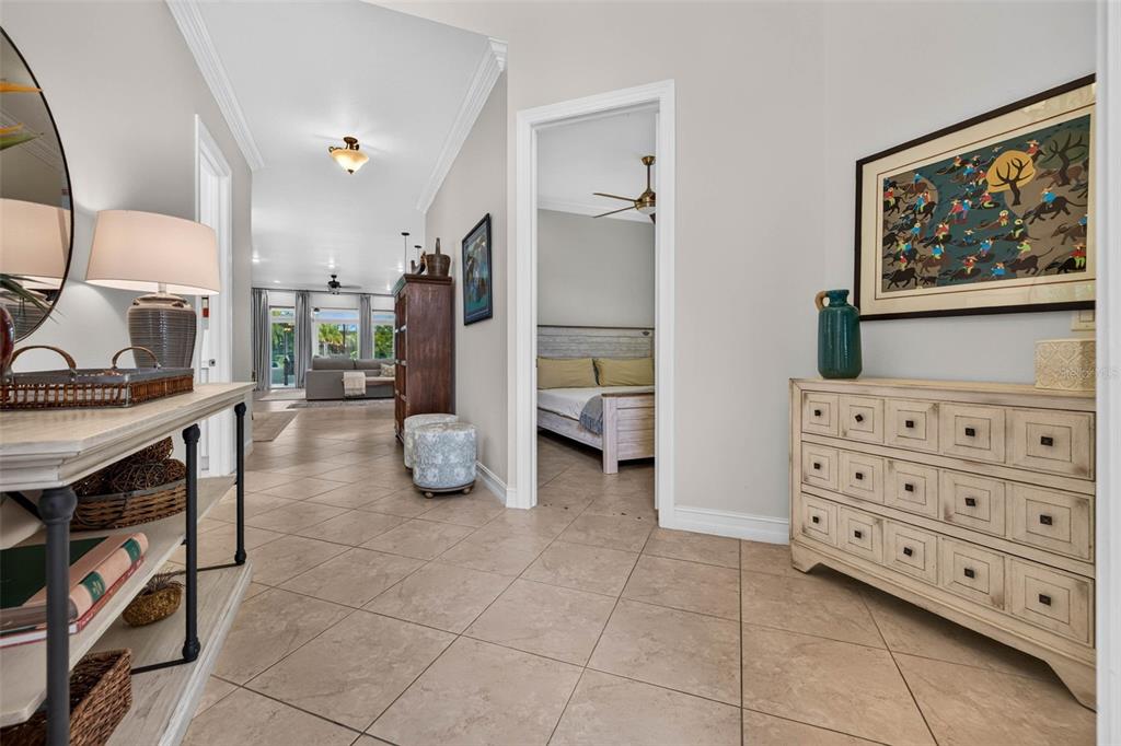 A tiled hallway leads to a living area with a bedroom visible through a doorway — 15929 GOLDEN LAKES DRIVE, WIMAUMA, FL