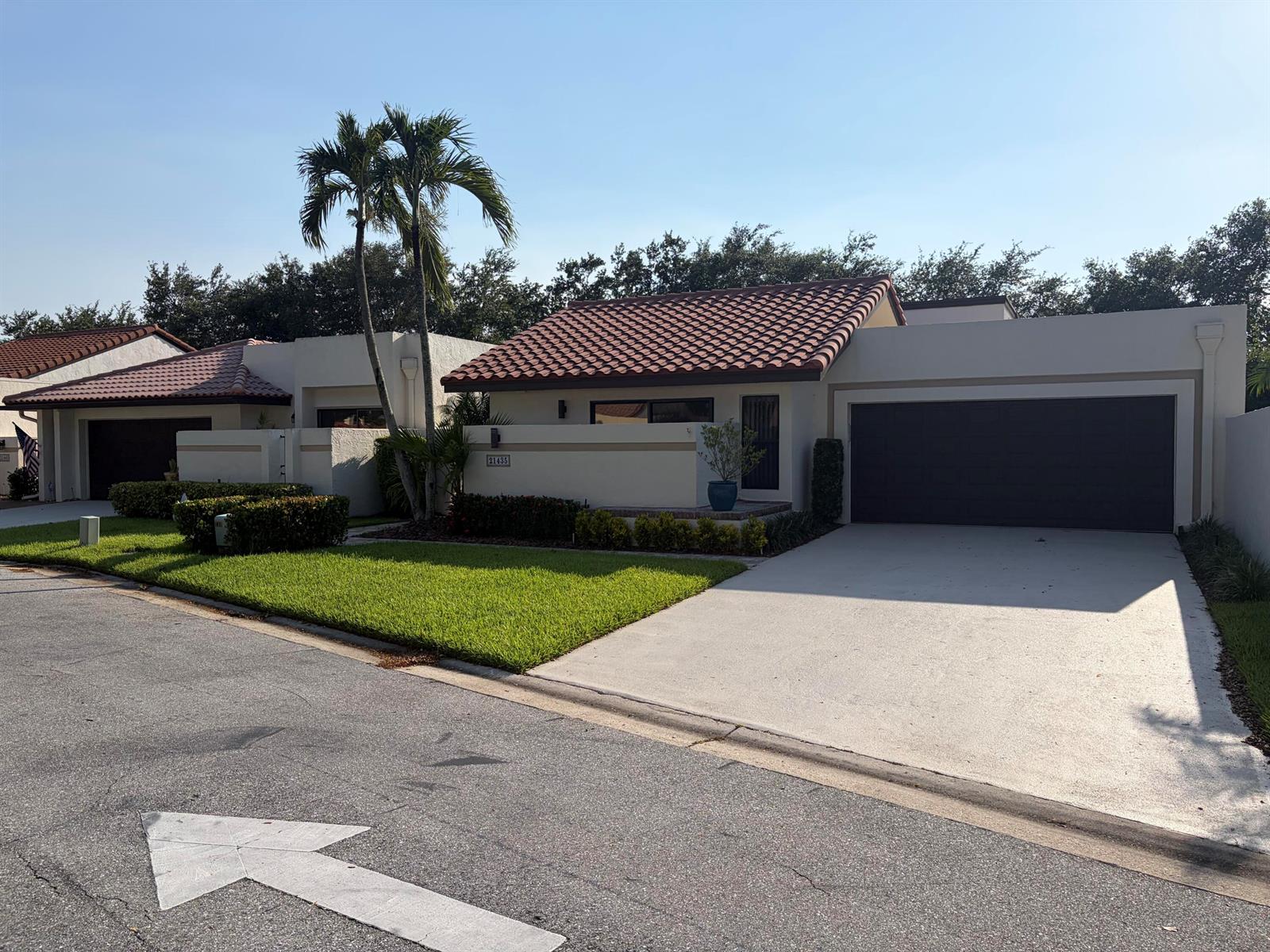 A single-story house with a tiled roof, a two-car garage, and a palm tree — 21435 Campo Allegro Drive, Boca Raton FL 33433, BOCA RATON, FL