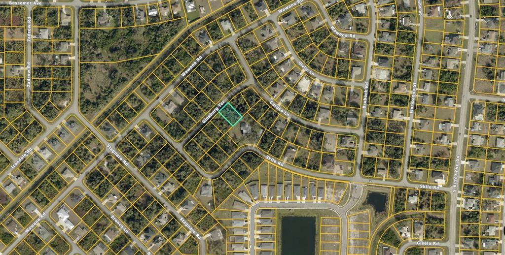 This is an aerial map showing a vacant residential lot highlighted in a suburban neighborhood — 0974180403 GINSBURG TERRACE, NORTH PORT, FL