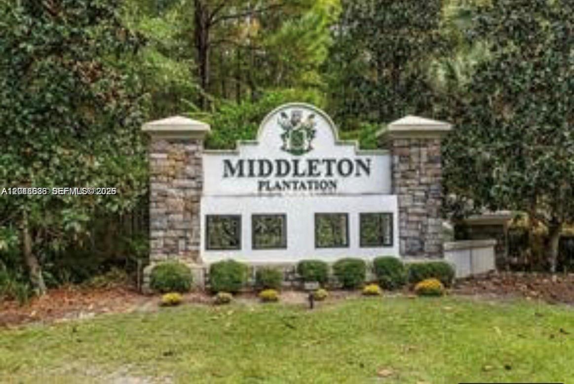 A stone and white monument sign marks the entrance to Middleton Plantation amidst lush trees — Lot 59 Magnolia Plantation, GA 31568, GA