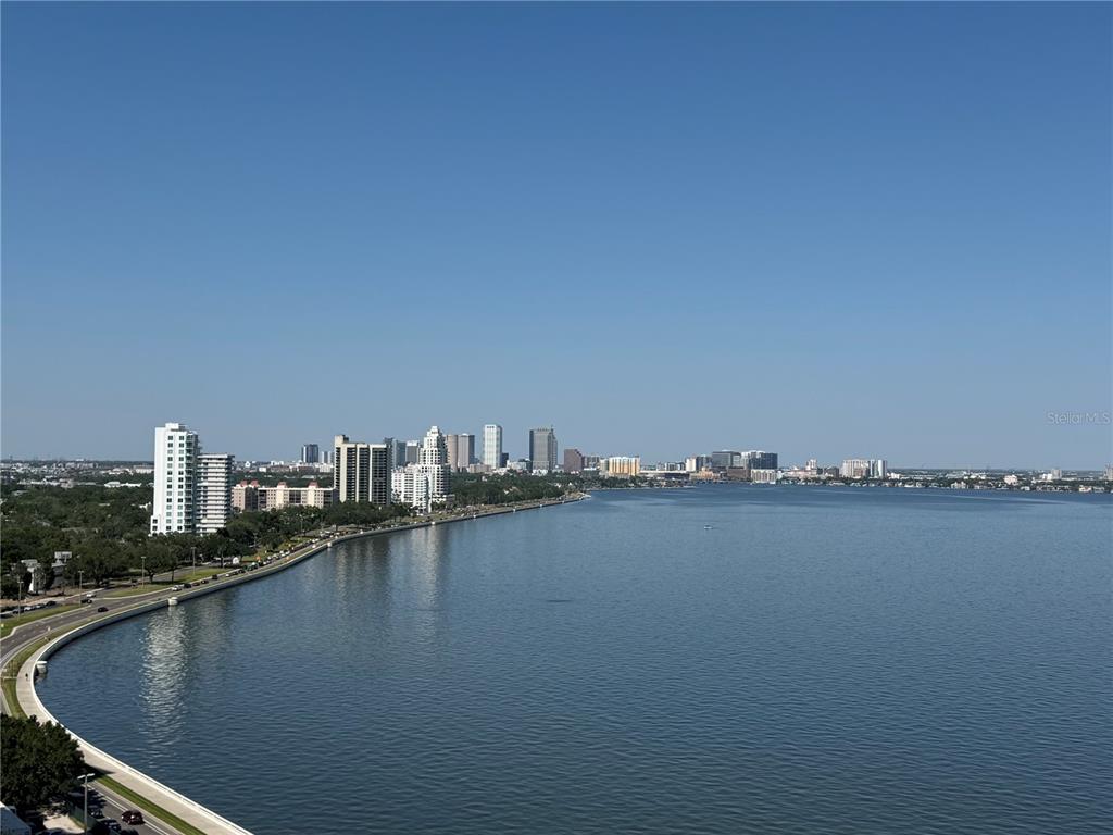 An elevated view of a city skyline across a large body of water — 3301 BAYSHORE BOULEVARD UNIT 2003D, TAMPA, FL