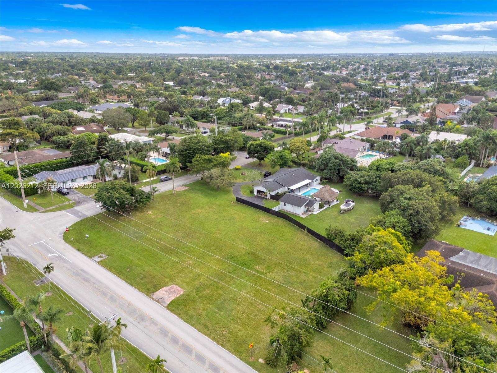 An aerial view shows a large residential lot with a house, pool, and surrounding trees — 13600 SW 107th Ave, Miami FL 33176, MIAMI, FL