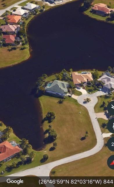 This aerial map view shows a vacant waterfront lot located at the end of a cul-de-sac — 17209 BARCREST LANE, PUNTA GORDA, FL