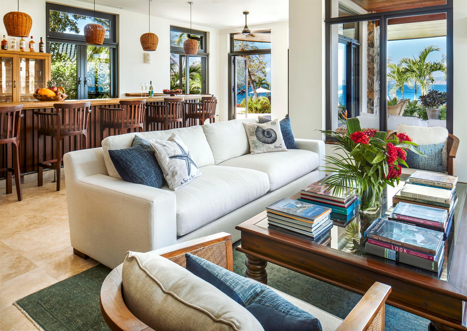 A living room with a white sofa, coffee table, and a bar area overlooking the ocean — 0 Valley Trunk Est-Virgin Gorda, FL
