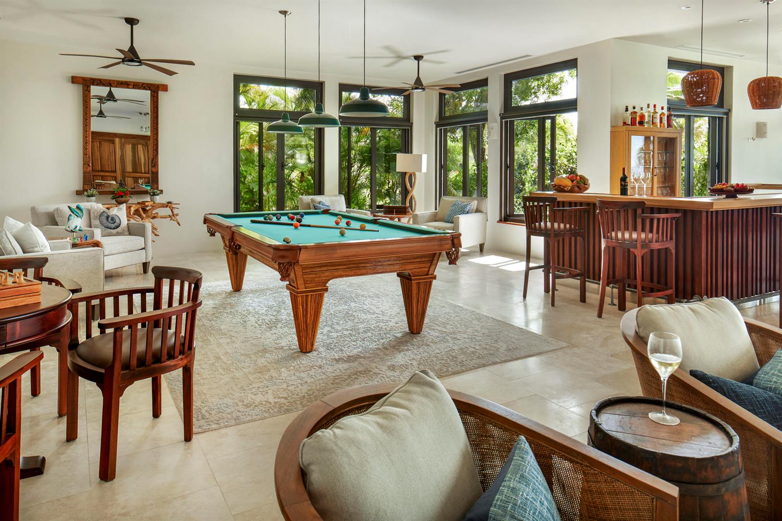A spacious game room features a pool table, a wooden bar, and comfortable seating areas — 0 Valley Trunk Est-Virgin Gorda, FL