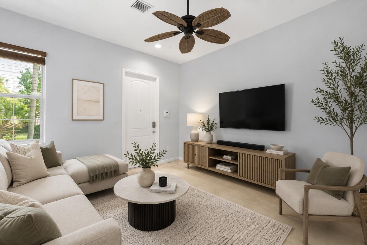 A living room features a beige sectional, a round coffee table, and a wooden media console — 468 Francesca Ridge Road, Boynton Beach FL 33435, BOYNTON BEACH, FL