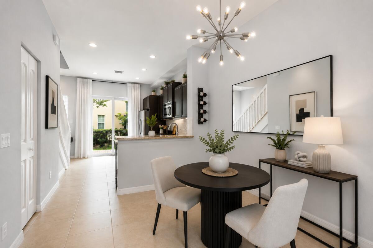 A dining area with a round table, two chairs, and a console table near a kitchen — 468 Francesca Ridge Road, Boynton Beach FL 33435, BOYNTON BEACH, FL
