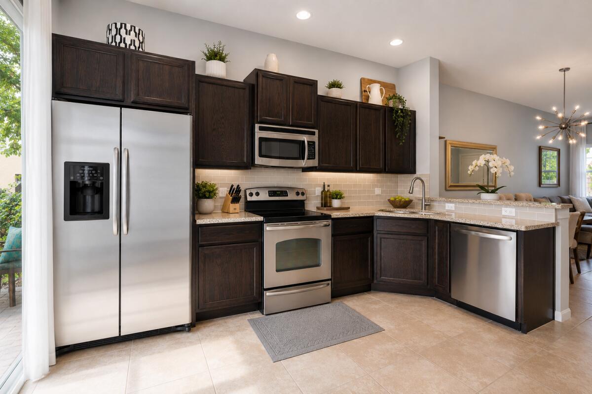 A kitchen with dark wood cabinets, stainless steel appliances, and light-colored countertops — 468 Francesca Ridge Road, Boynton Beach FL 33435, BOYNTON BEACH, FL