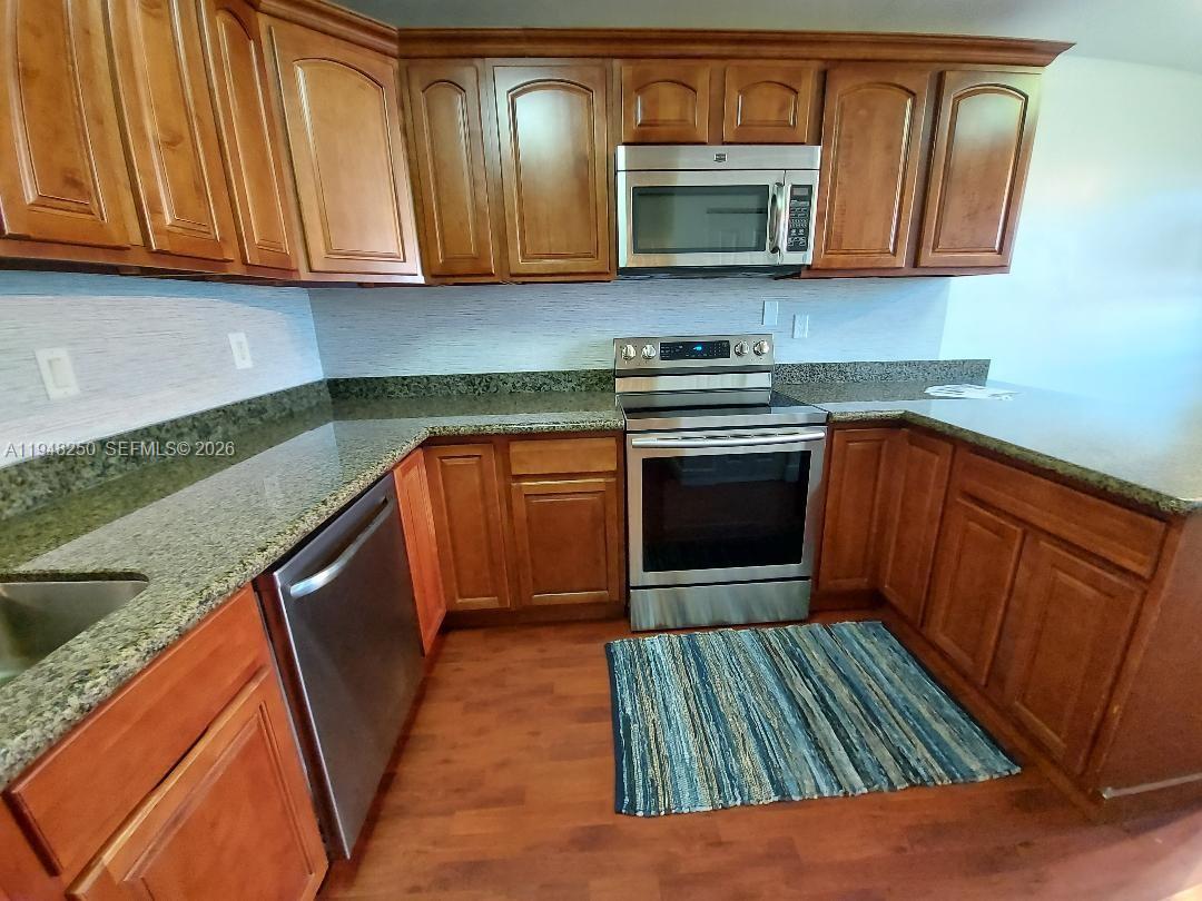 This is a two-story floor plan showing a living area, kitchen, bedrooms, and bathrooms — 20033 NE 2nd Pl, Miami FL 33179, MIAMI, FL
