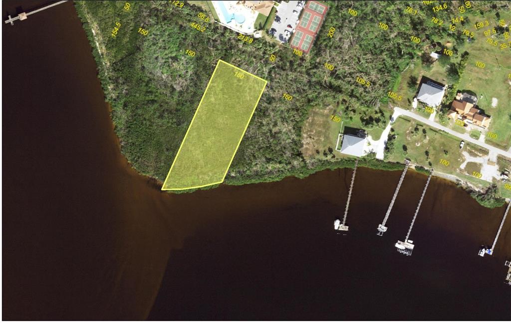 An aerial map shows a highlighted vacant waterfront lot next to existing homes and docks — 14163 RIVER BEACH DRIVE, PORT CHARLOTTE, FL