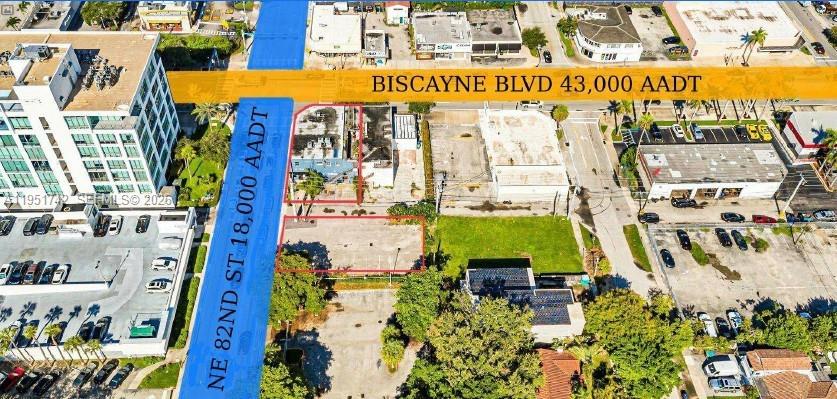 This aerial view shows a commercial property lot highlighted in red near a major intersection — 8201 Biscayne Blvd, Miami FL 33138, MIAMI, FL