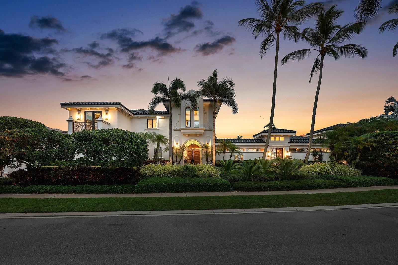 A two-story Mediterranean-style house with palm trees and a landscaped lawn at sunset — 3633 Carlton Place, Boca Raton FL 33496, BOCA RATON, FL