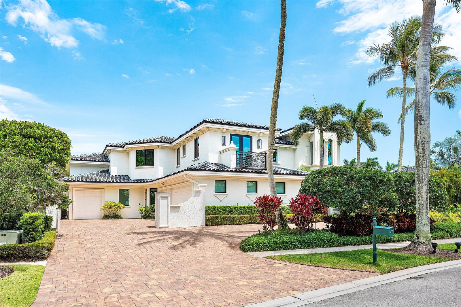 A two-story white stucco house with a tiled roof, brick driveway, and palm trees — 3633 Carlton Place, Boca Raton FL 33496, BOCA RATON, FL