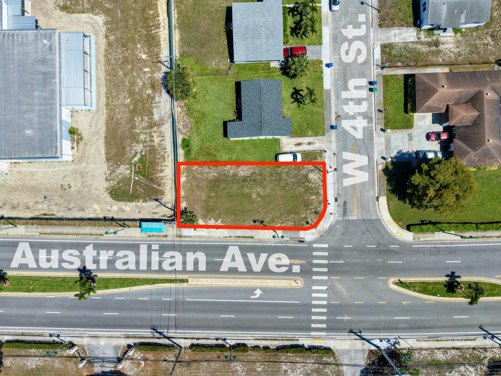 An aerial view shows a vacant, rectangular corner lot bordered by two paved streets — 0 Australian Avenue, Riviera Beach FL 33404, RIVIERA BEACH, FL