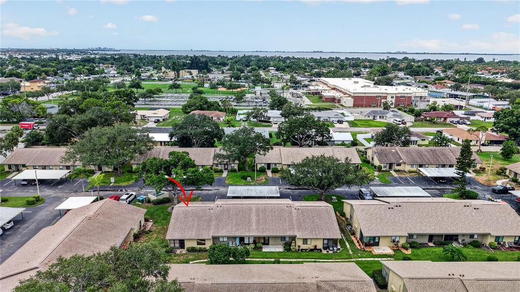 An aerial view shows a residential complex with tan buildings and parking lots — 2707 60TH AVENUE TERRACE W, BRADENTON, FL