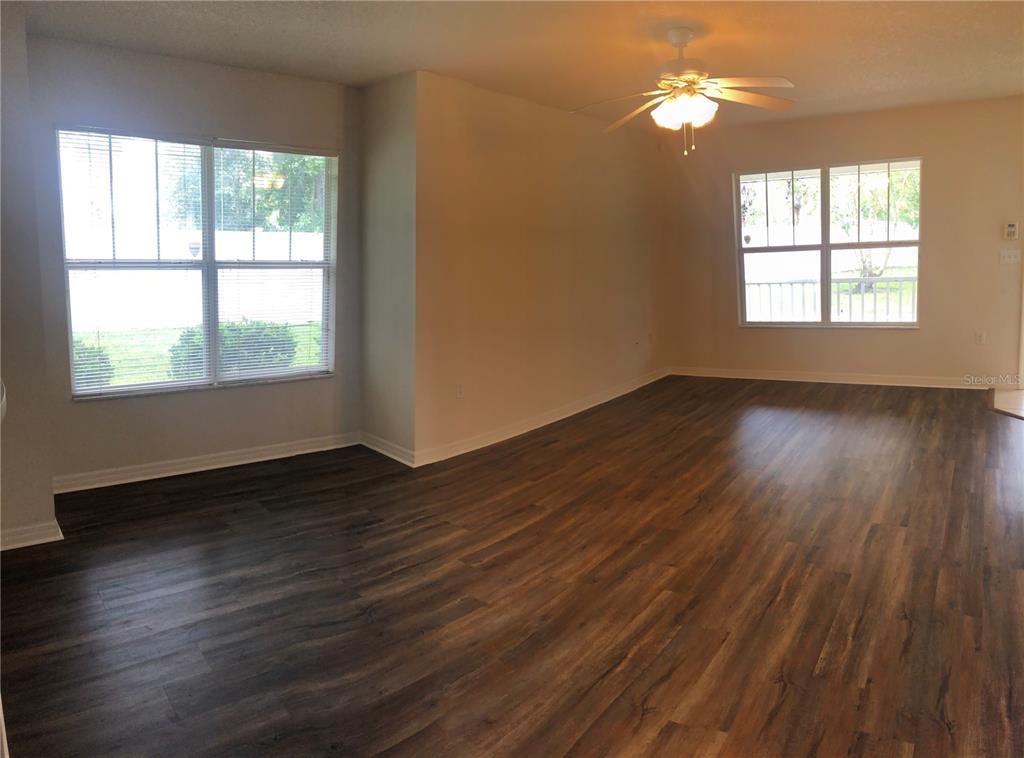 A front porch with a light-colored door, a window, and white railings — 2375 SW 42ND WAY UNIT 160, GAINESVILLE, FL