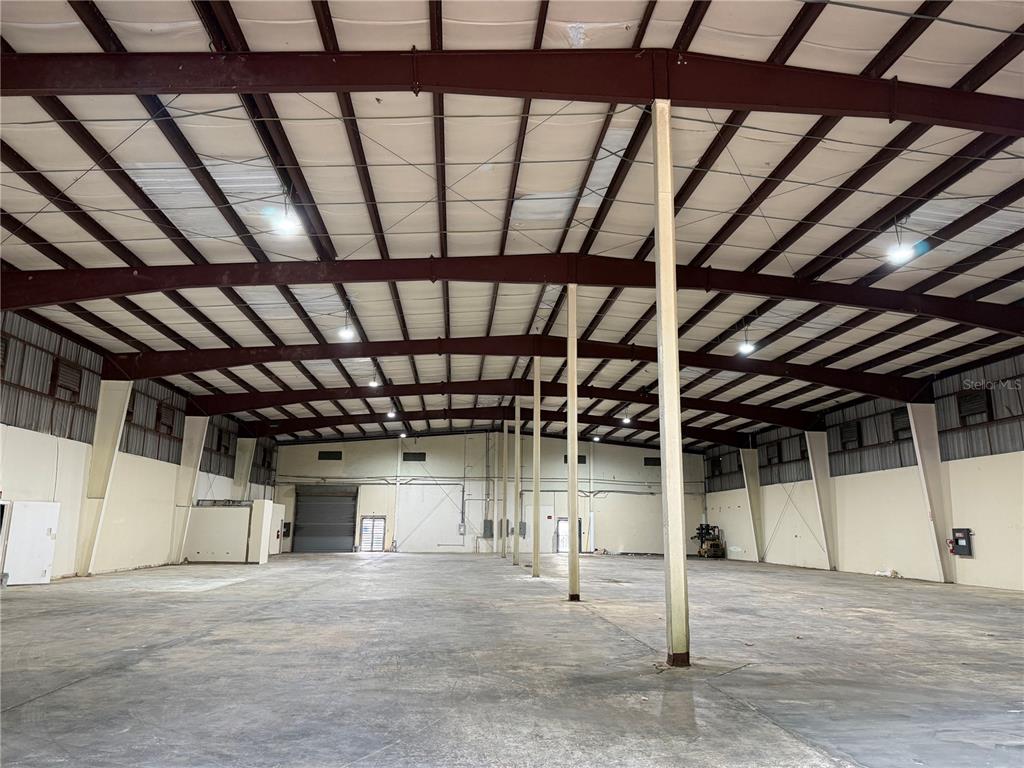 A large, open warehouse interior features a concrete floor, metal support beams, and high ceilings — Carr #2 KM 17.0, TOA BAJA, PR