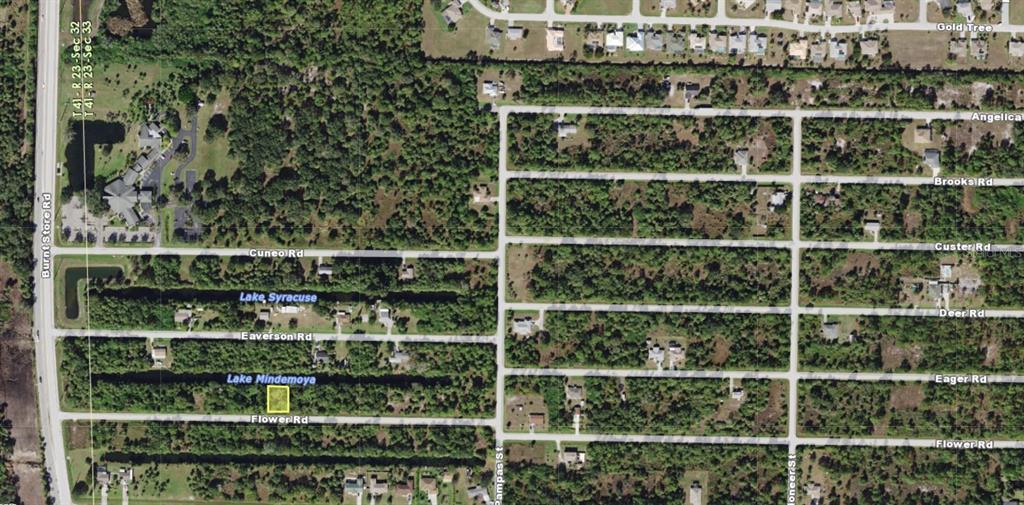 This aerial map shows a highlighted vacant lot located between Eager Road and Flower Road — 26074 FLOWER ROAD, PUNTA GORDA, FL