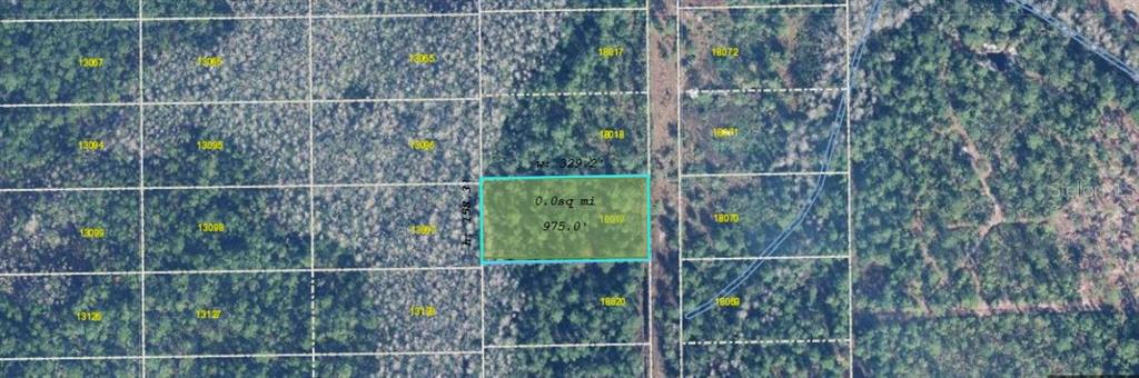 An aerial map view shows a rectangular plot of land highlighted in green — CHRISTMAS ROAD, ORLANDO, FL