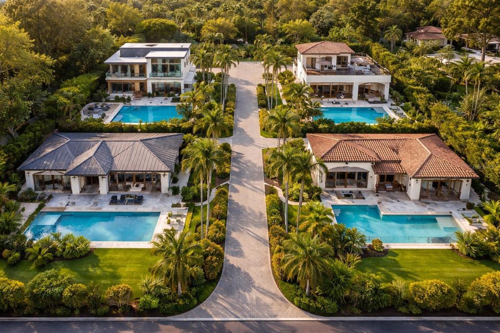An aerial view shows four luxury houses with swimming pools arranged around a central driveway — 2424 ASHTON ROAD, SARASOTA, FL