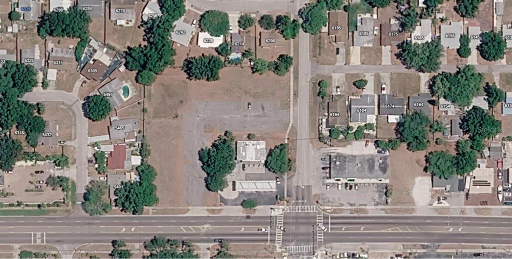 This is an aerial map view of a commercial property and surrounding residential neighborhood — 54TH AVENUE N, KENNETH CITY, FL