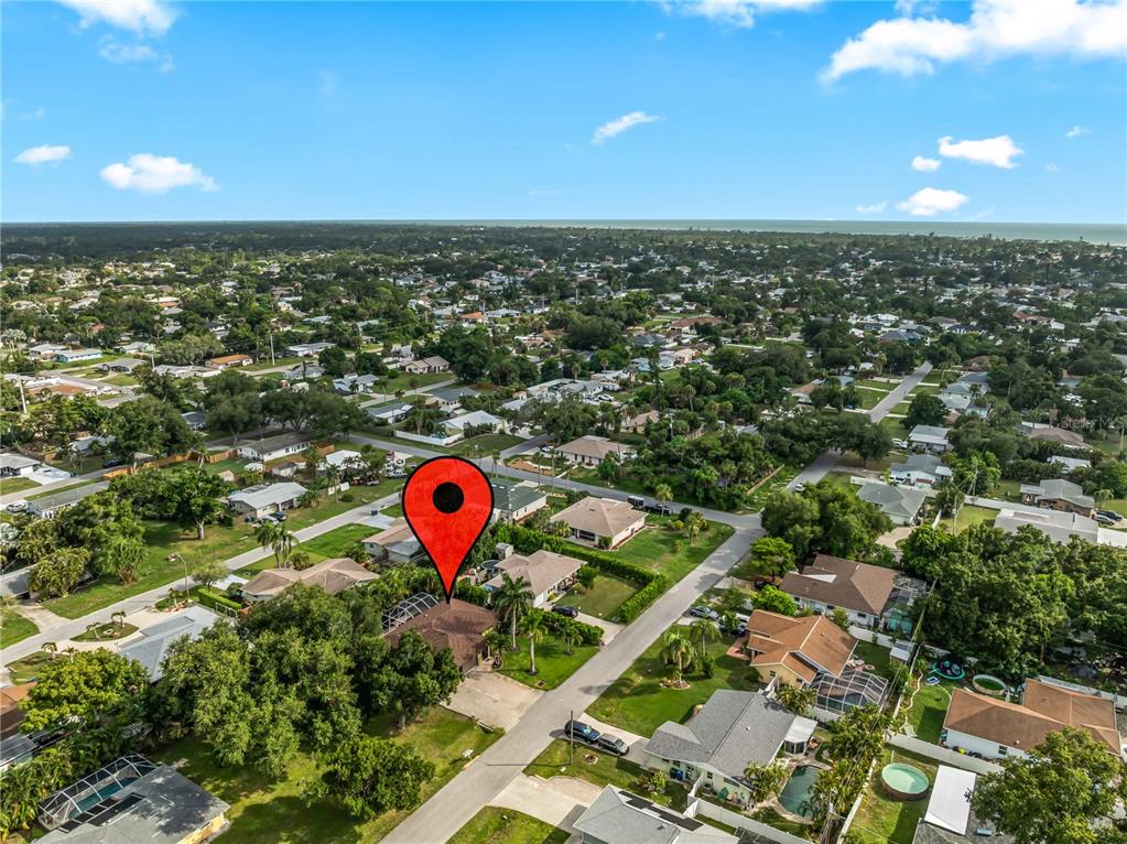 An aerial view shows a residential neighborhood with a red map pin marking a house — 251 PLANTATION ROAD, VENICE, FL