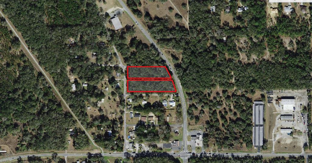 This aerial map shows two adjacent rectangular parcels of wooded land outlined in red — 7188 N FLORIDA AVENUE, HERNANDO, FL
