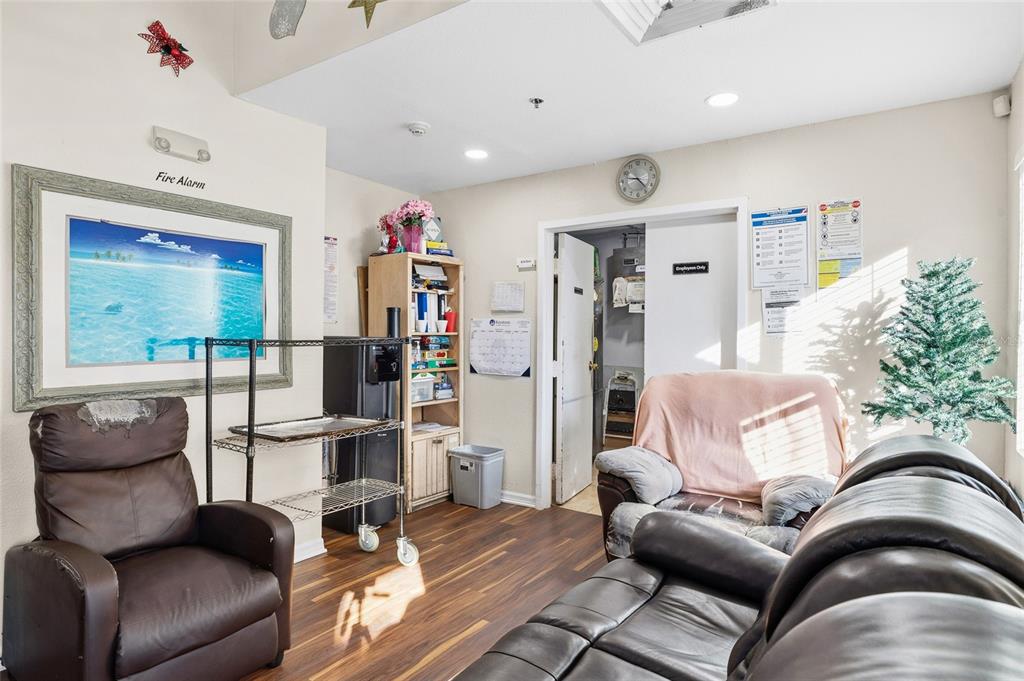 A waiting room features brown leather seating, a metal cart, a bookshelf, and a doorway — 820 15TH STREET N, ST PETERSBURG, FL