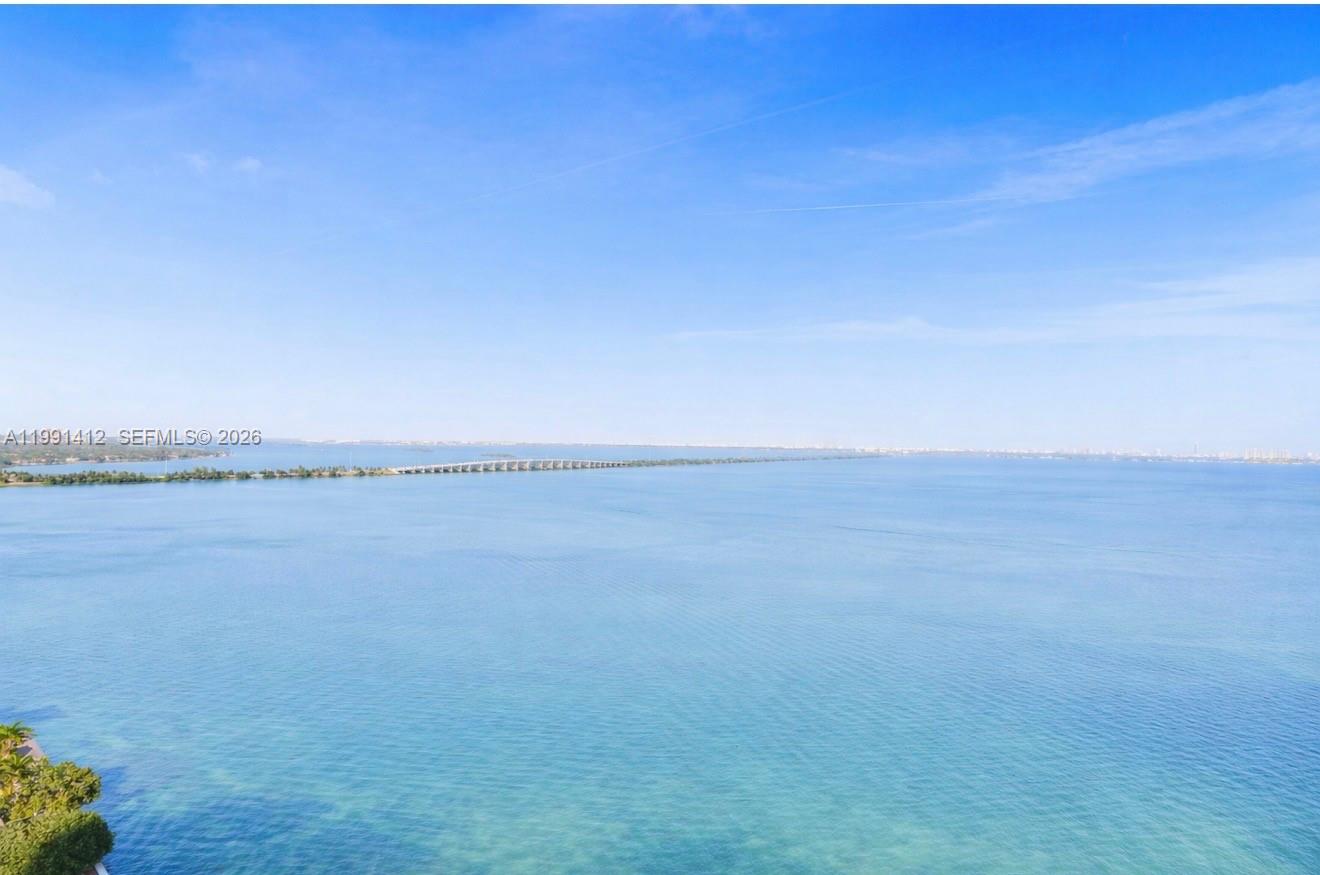 An elevated view of a large body of water with a long bridge in the distance — 665 NE 25th St # 2105, Miami FL 33137, MIAMI, FL