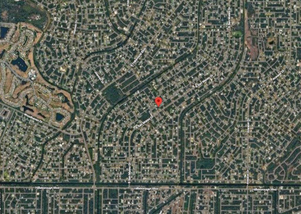 This is an aerial map view of a residential neighborhood with a red location pin — Lot 21 JUNCTION STREET, NORTH PORT, FL