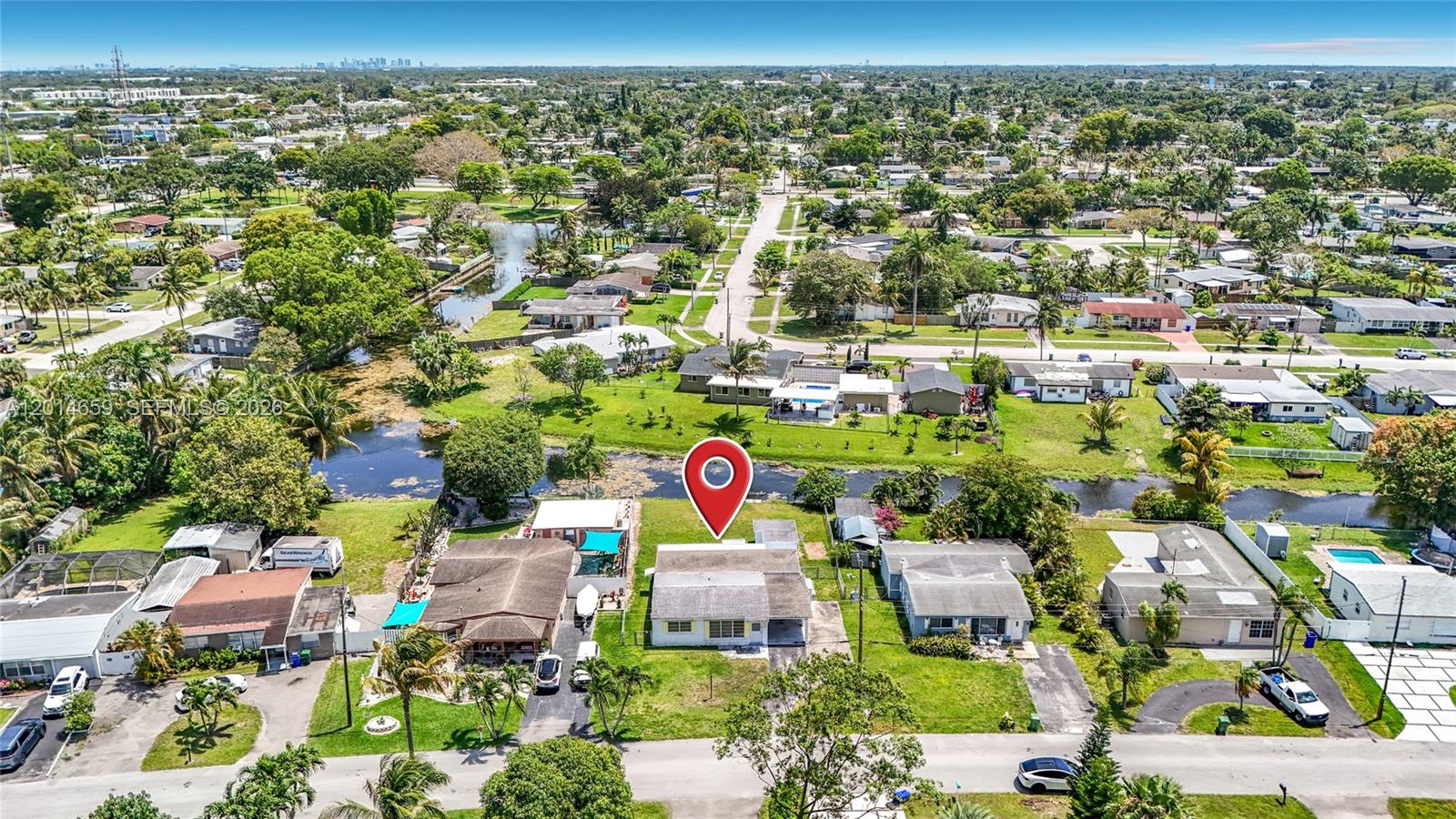 An aerial view shows a single-story house with a red map pin on a suburban lot — 5930 NW 24th Ct, Margate FL 33063, MARGATE, FL