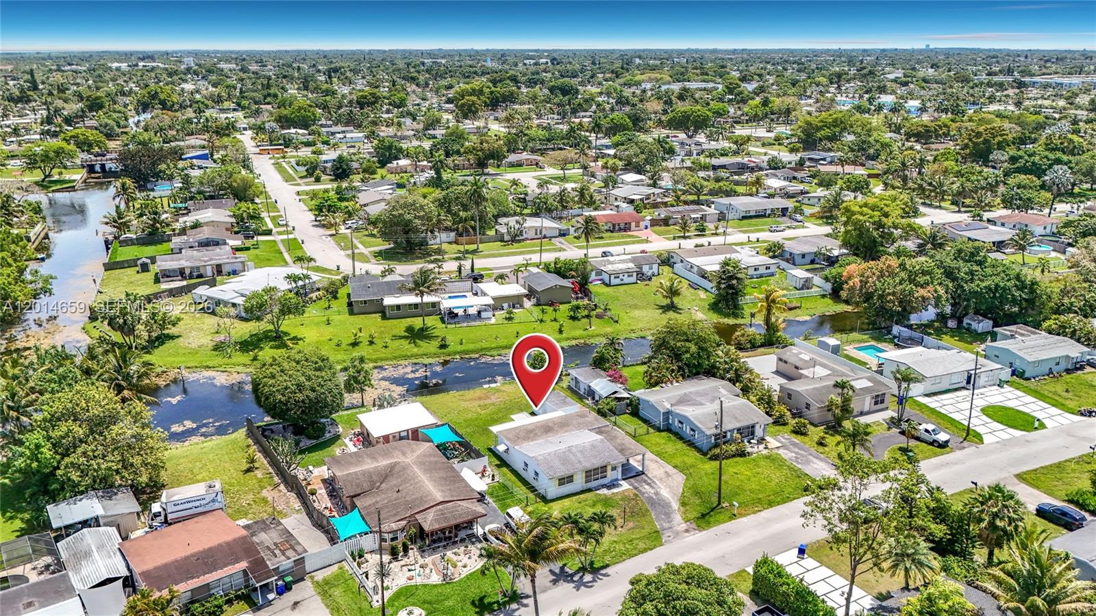 An aerial view shows a single-story house with a red location pin on a lot — 5930 NW 24th Ct, Margate FL 33063, MARGATE, FL