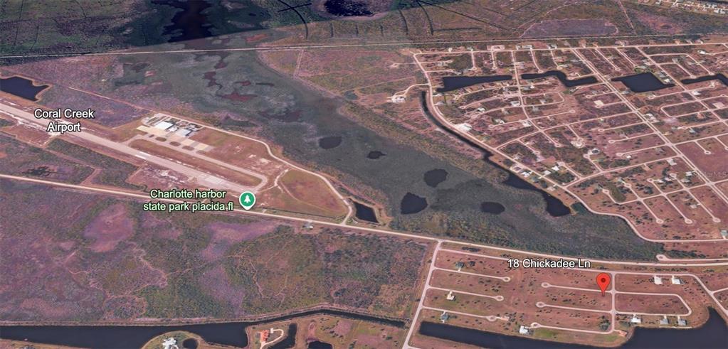 An aerial map view shows a residential neighborhood near an airport and a state park — 18 CHICKADEE LANE, PLACIDA, FL